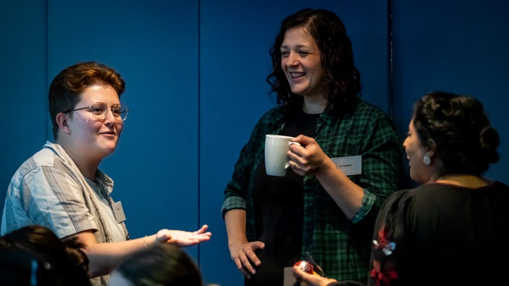 Three fellows at a JFF residential socialising